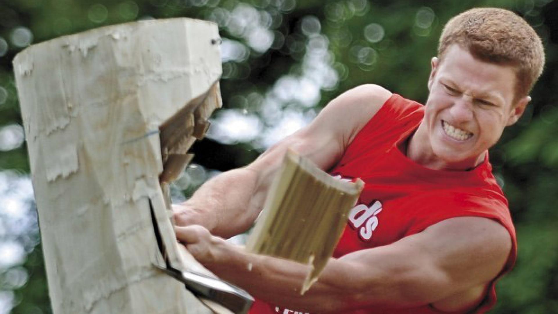 Stirling Hart drives into a vertical log in a wood-chopping competition.